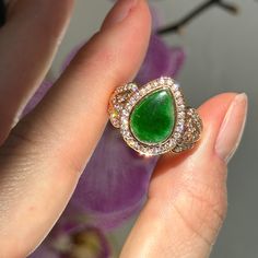 Estate 18KT Rose Gold Teardrop Pear Jade Jadeite Large Green Bezel Set w/ Halo Diamond Band Ring Beautiful, vibrant, dyed green jade!  Size 7 Weight: 8.70 grams Genuine jade measures: 12mm x 8mm stamped 18KT Excellent estate condition This is a great ring. Unique, well made Please take a look at our other jewelry items. Thank You, Legacy Saint Jewelry -OUR RETURN POLICY-  To return an item you must first contact us within 7 days of receiving your item(s). Upon messaging us we will provide the st Luxury Teardrop Emerald Ring As Gift, Luxury Teardrop Emerald Ring For Gift, Green Teardrop Luxury Rings, Pear-shaped Rose Cut Diamonds Jewelry, Luxury Green Teardrop Ring, Teardrop Emerald Ring Fine Jewelry, Elegant Pear-shaped Cubic Zirconia Emerald Ring, Luxury Teardrop Gemstone Rings, Multi-stone Diamond Emerald Ring