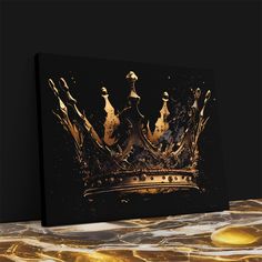 a gold crown on a black and white marble surface with water drops coming out of it