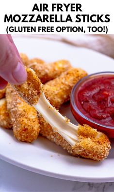 a person dipping sauce on top of some fried food with the words air fryer mozzarella sticks gluten free option, too