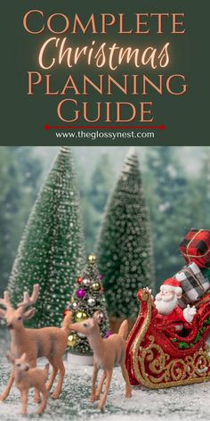 the complete christmas planning guide with santa and reindeer figurines in front of trees