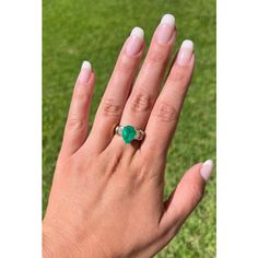 This ring presents a sophisticated blend of elegance and luxury, showcasing a 3.22 carat pear-shaped natural Colombian emerald center stone. Adorned with 0.66 CTTW in baguette-cut diamond side stones. The center stone is set in a 3-prong setting with an open back, allowing the emeralds vivid green hue to radiate brilliantly and securely.   Item Details: - Type: Ring  - Metal: 18K Yellow Gold  - Weight: 8.0 Grams  - Setting: 3-Prong  - Size: 7 (adjustable)  Emerald Details: - Carat: 3.22  - Cut: Green Pear-shaped Emerald Gemstone Ring, Green Pear-shaped Emerald Ring, Classic Green Teardrop Emerald Ring, Green Pear-shaped Emerald Ring For Anniversary, Luxury Pear-shaped Brilliant Cut Emerald Ring, Fine Jewelry Emerald Ring With Pear Gemstone, Pear-shaped Emerald Ring In Fine Jewelry Style, Pear-shaped Emerald Ring, Fine Jewelry, Pear-shaped Brilliant Cut Emerald Ring