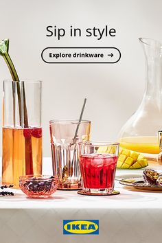 a table topped with glasses filled with different types of drinks