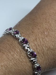 This pink Tourmaline bracelet is very lively and bright. The stones are deep colors and well matched. The sterling silver is plated with rhodium to protect the bracelet from tarnish and give the appearance of white gold. 7.5 inches My jeweler can shorten this for a $10 fee All jewelry is shipped in a nice gift box. Check out our over a THOUSAND great reviews Engraving is $4 per letter and is not always perfect depending on the piece. It can take a few days if the jeweler is busy. This is payable Sterling Silver Gemstone Tennis Bracelet, Pink Gemstone Sterling Silver Bracelet, Silver Tennis Bracelet, Mermaid Ring, Tourmaline Bracelet, Vintage Gothic, Heart Locket, Deep Colors, Tennis Bracelet