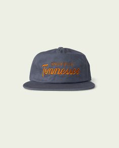 Our Tennessee script set in a rocky top colorway, embroidered on our unstructured cotton 5-panel. Embroidered One size fits all Cotton fabric Unstructured, low profile Adjustable fabric strap with brass metal grommet HANG embroidered thumbs up mark on side Cotton Adjustable Snapback Hat For Baseball Season, Adjustable Cotton Snapback Hat For Baseball Season, Adjustable Cotton Snapback Hat, Adjustable Cotton Trucker Hat With Flat Bill, Adjustable Cotton 5-panel Baseball Cap, Cotton Baseball Cap With Embroidered Logo And Flat Bill, Cotton Trucker Hat With Embroidered Logo Flat Brim, Cotton Baseball Cap With Embroidered Logo And Flat Brim, Cotton Snapback Hat For Baseball Season With Flat Brim