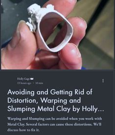 someone is holding up a ring that looks like it has been made out of clay