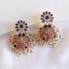 We bring beautiful Jewelry sure to elevate any look! Kindly pay attention to all photos and video and ask questions about the item prior to ordering. Luxury Elegant Earrings For Navratri, Cheap Traditional Earrings For Navratri, Traditional Pearl Drop Jhumkas, Traditional Pearl Drop Round Jhumkas, Traditional Round Jhumkas With Pearl Drop, Traditional Pearl Earrings With Tilla For Celebration, Traditional Style Tilla Pearl Earrings For Celebration, Traditional Tilla Pearl Earrings For Diwali, Traditional Multicolor Pearl Earrings For Celebration