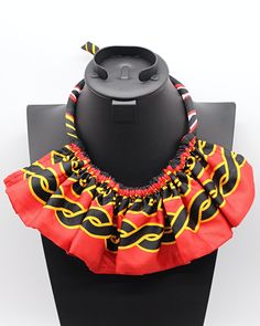 These are African print Ankara jewelry sets are made with Toghu satin print from Cameroon. This necklace doesn’t need much, put it over a simple slip dress and you are the talk of the whole party. This is a true conversation starter.Select your Set: 1 necklace, 4 small bangle bracelets ( 2 red and 2 toghu print)+/_ Earrings Fabric: Polyester satin African Print fabric- Necklace is tied behind the neck- Earrings have different shapes. You can receive one of the shape in the pictures or a differen Traditional Summer Necklace, Elegant Red Necklace For Summer, Ankara Jewelry, African Fabric Accessories, Simple Slip Dress, Earrings Fabric, African Print Skirt, Fabric Necklace, Fabric Accessories