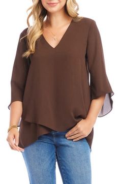 An elegant top of silky, lightweight crepe delivers elegant movement with its angled flare sleeves and fluttery asymmetrical hemline that dips low in back. 25 1/2" length (size Medium) V-neck Three-quarter sleeves Back yoke with gathering Crossover high/low hem 100% polyester Dry clean or hand wash, line dry Made in the USA of imported fabric Women's Clothing Flowy Asymmetrical Hem Blouse For Spring, Flowy Spring Blouse With Asymmetrical Hem, Flowy Blouse With Asymmetrical Hem For Spring, Elegant Asymmetrical Solid Blouse, Chic Viscose Top With Asymmetrical Hem, Chic Viscose Tops With Asymmetrical Hem, Chic Flowy Blouse With Asymmetrical Hem, Asymmetrical Blouse With Draped Sleeves, Solid Asymmetrical Hem Blouse For Layering