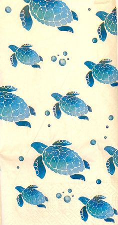 a tea towel with blue turtles on it and bubbles in the water, as if they were swimming