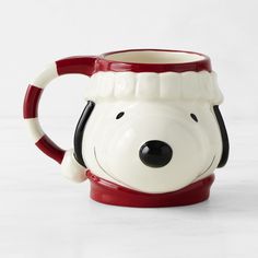 a ceramic mug with a dog's head on it