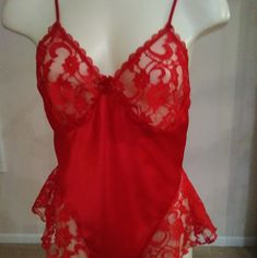 Soft And Sexy Teddy Has Adjustable Straps And Snap Crotch. Wide Lace Borders The High Cut Leg Openings. Cute Flower In Front Decorates The Neckline. 100% Polyester. Machine Wash Warm Gentle Cycle. Tumble Dry Low. Remove Promptly. Do Not Twist Or Wring. Made In U.S.A. Nwot Red Stretch Camisole For Party, Red Camisole For Party, Red Camisole With Built-in Bra For Night Out, Coquette Lace Red Sleepwear, Red Fitted Lace Camisole, Fitted Lace Red Camisole, Red Fitted Lace Sleepwear, Red Lace Trim Sleepwear, Red Sheer Lace Sleepwear