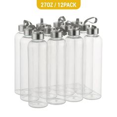 six clear glass bottles with silver lids