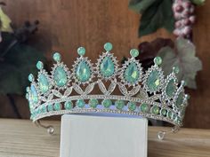 Beautiful, sparkles, good quality Tiara with Big Sage Stones and Crystal Rhinestone set on Silver the Tiara. Perfect for Prom, Birthday, Sweet 16, Quinceanera, Anniversary, Wedding, or for any other special occasion. Or just to be THE QUEEN. THE COLORS ON THE TIARA: Silver the tiara frame, Sage Green and Crystal clear Rhinestone. THE SIZE 2" tall on the front. 1" tall on the sides. GIFT BOX IT'S NOT INCLUDED! This item it will send on STANDARD FIRST CLASS MAIL (2 to 5 business days). in USA If y Jade Tiara, Cinderella Tiara, Wedding Sage Green, Birthday Sweet 16, Quinceanera Tiaras, Tiara Silver, Prom Birthday, Silver Tiara, Tiara Wedding