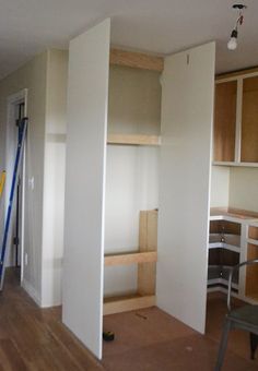 an empty room with some shelves in it