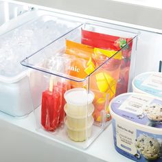 an ice cream container filled with lots of different types of frozen drinks and desserts