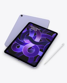 an ipad with a pen next to it on a white surface and the cover is purple