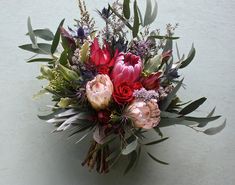 a bouquet of flowers sitting on top of a table