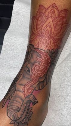 an elephant tattoo on the arm and leg