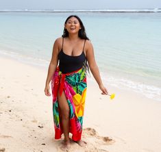 UNIQUE HAND-PAINTED DESIGNEmbrace your curves with our plus-size women's sarong swimsuit cover-up, featuring a stunning hibiscus flower print. This one-of-a-kind piece is inspired by nature and traditional motifs, adding a touch of tropical charm to your beach or poolside look. VERSATILE AND MULTIFUNCTIONALPerfect for the beach or pool, this plus-size pareo wrap can also be worn as a scarf, shawl, or wrap. Transform it into a beautiful skirt or dress by wrapping and tying it in different styles, offering endless possibilities for your beachwear ensemble. SOFT AND BREATHABLE FABRICCrafted from high-quality rayon, this cover-up is gentle on the skin and ideal for hot and humid weather. It includes a coconut clip for an easy tie, ensuring a secure and fashionable fit for your curves. PLUS SIZ Look Praia Plus Size, Long Pool, Hibiscus Flower Print, Sarong Swimsuit Cover, Beach Wrap Skirt, Poncho Outfit, Pareo Sarong, Pool Resort, Plus Size Beach