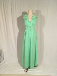 "1970s handmade dress sherbet green polyester rainbow ric rac trim wide high waist band big double breast collar back neck hook eyes zip up back waist straps from back collar down back plunge sleeveless arm pit full length good vintage condition, light wear measures, lying flat, bust at fullest-19\" waist band-14 1/2\" top to waist band at center top-12 1/2\" hip-free total length-60\" (5')" Glam Gown, Maxi Halter Dress, Empire Waist Gown, Disco Glam, Black Leather Motorcycle Jacket, Dress Empire Waist, Handmade Dress, Lovely Tops, Ric Rac