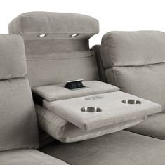 the reclining couch has two cup holders on it