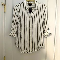 Black And White Striped Button Down Shirt. 3/4 Sleeves Fold Up. Chic White Blouse With Roll-up Sleeves, White Blouse With Rolled Sleeves For Work, White Blouse With Rolled Sleeves For Fall, White Button-up Blouse With Rolled Sleeves, White Rolled Sleeves Button-up Blouse, Chic White Shirt With 3/4 Sleeves, Chic Blouse With Roll-up 3/4 Sleeves, Chic Blouse With 3/4 Roll-up Sleeves, White 3/4 Sleeve Blouse For Work