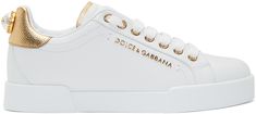 Low-top buffed leather sneakers in white. Round toe. Tonal lace up closure. Gold-tone logo stamp and trim at tongue. Padded collar. Faux-pearl embellished logo plaque at gold-tone heel tab. Tonal rubber sole. Gold-tone hardware. Supplier color: White Pearl Sneakers, Shoes Dolce Gabbana, Dolce Gabbana Sneakers, Sneaker Art, Dolce Gabbana Shoes, Mid Top Sneakers, Girls Sneakers, Low Sneakers, Gold Pearl