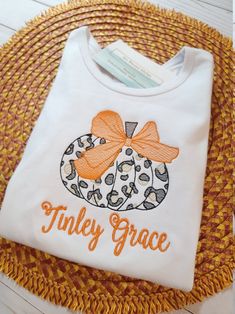 Fall pumpkin shirt * personalized * available in both long and short sleeve * ships free within 7-9 business days Thanks for shopping with Sew Blessed Stitches! We would love to connect with you on social media. You can find us at: Instagram@sewblessedstitches Facebook.com/sewblessedstitches Pinterest@sewblessedstitches Email - sewblessedstitches@bellsouth.net Cotton T-shirt With Name Print For Fall, Long Sleeve T-shirt With Machine Embroidery For Fall, Embroidery Outfits, Little Pumpkin Shirt, Leopard Pumpkin Shirt, Personalized Treat Bags, Pumpkin Monogram Shirt, Fall Monograms, Fall Embroidery