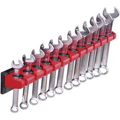 an assortment of wrenches are lined up in a row