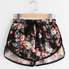 Floral Shorts. Black Contrast Piping. Stepped Hem. Short Inseam. Elastic Waistband. 95% Polyester, 5% Spandex (Some Light Stretch). Check Measurements For Correct Size Day Drinking Outfit, Drinks Outfits, Dolphin Shorts, Older Women Fashion, Active Wear Shorts, Elastic Waist Shorts, Floral Print Shorts, Floral Shorts, Bottom Clothes