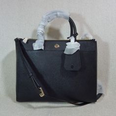 Price Is Firm Robinson Double-Zip Tote By Tory Burch. This Bag Is Made Of Black Color Saffiano Genuine Leather. If You Are Not Familiar With The Characteristic Of Saffiano Leather Please Research About It Before Placing Your Order. Saffiano Leather May Feel Like Faux Leather To Some But It Is Actually Made Of Genuine Calf Leather This Bag Is Perfect As A Daily Use Bag. Dimensions: 12" Wide Across Bottom X 10" Tall Center X 5" Deep. Double Handle 4" Drop. Comes With 17" Drop Long Detachable Strap Elegant Saffiano Leather Bag With Zipper Closure, Black Saffiano Leather Bag With Zipper, Navy Fabric, Zip Tote, Ladies Handbags, Tory Burch Bags, Tory Burch Bag, Zipper Top, Womens Tote Bags