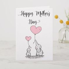 a mother's day card with an elephant holding a heart balloon in the air