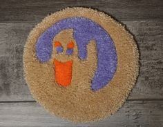 a door mat with an orange and purple design on it