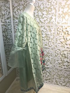 Very chic mint green jamawar on organza jacket, with bell sleeves and floral embroidery, it comes with silk matching inner, and ivory bell bottom. Brand: Bonita, Chen One Shipping USPS 2 day Tissue Silk Long Sleeve Sharara For Party, Long Sleeve Tissue Silk Sharara For Party, Elegant Brocade Dupatta With Dabka Detailing, Festive Long Sleeve Lawn Suit In Tissue Silk, Green Floral Embroidered Tissue Silk Sets, Green Tissue Silk Sets With Floral Embroidery, Festive Long Sleeve Tissue Silk Lawn Suit, Long Sleeve Tissue Silk Traditional Wear For Party, Festive Tissue Silk Lawn Suit With Long Sleeves