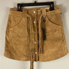 *Nwt Never Worn* Blank Nyc 100% Leather Suede, Button Front, Tan Mini Skirt W/ Belt. High Waisted, Snap Button Front Closure, Fully Lined, Fringe Belt, And Front Pockets And Back Pockets. - Size 29 - Color: Tan - Measurement Across Waist 16” - Measurement Across Hips 20”-20.5” - Measurement From Top To Bottom 17” Fall Leather Skirt With Button Closure, Chic Fall Skirt With Snap Buttons, Chic Skirt With Snap Buttons For Fall, Leather Skirt With Belt Loops For Fall, Fall Mini Skirt With Snap Buttons, Fall Leather Mini Skirt With Belt Loops, Tan Mini Skirt, Brown Suede Skirt, Fringe Belt