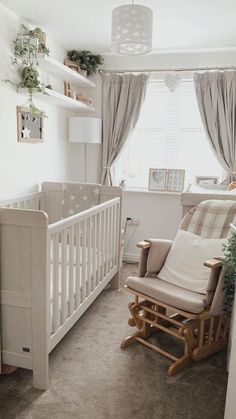 a baby's room with a rocking chair and crib