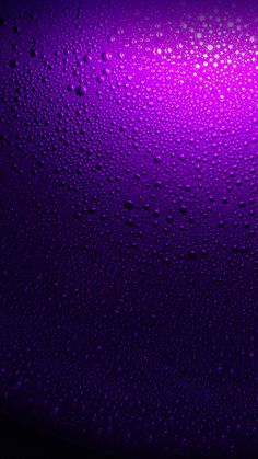 water drops on the surface of a purple background