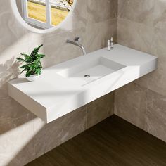 a white sink sitting under a round window