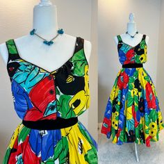 1980s dress / 80s dress / vintage 1980s dress / 1980s does 1950s dress / 1980s dress / vintage 1950s style dress / vintage sundress This 1980s sundress is amazing. First let me start by saying this is one of those simple dresses that has so much style. She is a sundress with a button front and a comfortable elastic waist band. But what I really love is her vibrant print and the full skirt with hidden pockets! Classic sundress cut, but with a gorgeous bold colors means you will never see anyone else in this dress! Truly a timeless dress made for fun!  Measurements provided are flat and have been doubled. Bust 36"  Waist 26-28" range  Hips free Length  48" ❤️ Condition: Excellent vintage condition. Flaw: none found. Belt in photos not included. This item has been cleaned and is ready to wear Retro A-line Vintage Dress For Summer, Vintage Style Summer Midi Dresses, Vintage Style Midi Length Summer Dresses, Summer Vintage Midi Dress, Vintage A-line Summer Dresses, Summer A-line Midi Dress For Vintage Fashion, Summer Vintage Fashion A-line Midi Dress, Summer Vintage A-line Midi Dress, Summer Sleeveless Vintage 1950s Style Dress