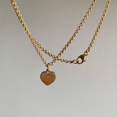 This stunning, sparkling diamond heart sits in its gold bezel with unwavering intention: a true joy to wear and behold. 18k yellow gold SII G-H diamond, 0.68ct, 7mm x 6mm (5/16" x 1/4")Chain is 18" long Delicate Yellow Gold Heart Pendant Necklace, Delicate Yellow Gold Heart Pendant Charm Necklace, Heart-shaped Yellow Gold Charm Necklace In Sterling Silver, 14k Gold Heart Cut Diamond Jewelry, Delicate Yellow Gold Heart Necklace With Round Pendant, Dainty Yellow Gold Heart Necklace With Charm, 14k Gold Heart-shaped Jewelry, Yellow Gold Heart Charm Necklace In Sterling Silver, Yellow Gold Heart Pendant With Single Diamond