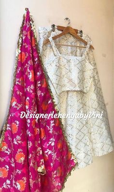 All size available from S to 5XL Fabric details- Top & lehenga- Georgette base Dupatta- Banarasee silk Blouse design can be customized. Length of lehenga can be customized (standard length- 41 inches). Designer Banarasi Silk Lehenga With Gota Work, White Art Silk Lehenga With Dupatta, White Art Silk Lehenga With Sheer Dupatta, Banarasi Silk Lehenga With Gota Work For Diwali, Designer White Banarasi Silk Sets, Festival Banarasi Silk Lehenga With Gota Work, Navratri Banarasi Silk Lehenga With Sheer Dupatta, Unstitched Banarasi Silk Lehenga With Sheer Dupatta, Fitted Banarasi Silk Lehenga With Sheer Dupatta