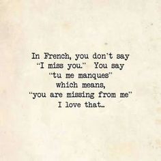 an old typewriter with the words in french, you don't say i miss you