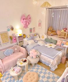 this is a dollhouse bedroom with pink and blue decor