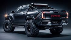 the toyota pickup truck is shown with its lights on