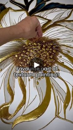 someone is painting a large flower with gold paint on it's petals and the words, bayoue part of textured painting?