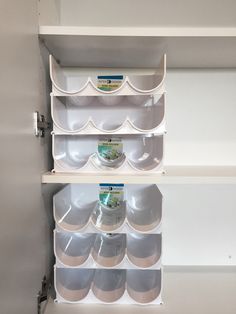 the shelves have bowls and plates on them