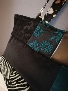 a handbag hanging from the side of a wall