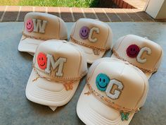 We are so excited to now be offering trucker hat party packs!! This is a way to get a bulk discount of our hats. Great for bachelorette trips, beach trips, parties, etc.  We will message you after your order is placed regarding chain options, smiley face colors, and initials. Hats can also be done in other colors. Please feel free to message us with any questions.  Each hat will come with two patches, two hat chains that are removable and interchangable, and studs on the brim if wanted. Cute Trucker Hats With Patches, Bachelorette Party Trucker Hats, Trucker Hat Charms, Trucker Hat Party, Beach Trucker Hat, Diy Trucker Hat With Patches, Trucker Hat With Patches