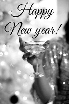 a woman holding a martini glass with the words happy new year