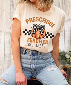 Get ready for the season with our Preschool Fall Pumpkin Teacher Shirt! This charming PreK teacher tee is perfect for celebrating the autumn months and Thanksgiving with your little learners. Whether you're in the classroom or celebrating the holidays, this shirt is a must-have for any thankful preschool teacher. Product Description: ⇝ Bella and Canvas Brand Shirts ⇝ Unisex Adult Sizing ⇝ Rolled Sleeves in pictures are for styling purposes only ⇝ Props used in photos for are NOT included with pu Thankful Preschool, Prek Teacher Shirts, Prek Teacher, Preschool Fall, School Secretary, Fall Tshirt, Kindergarten Teacher Shirts, Brand Shirts, Rolled Sleeves